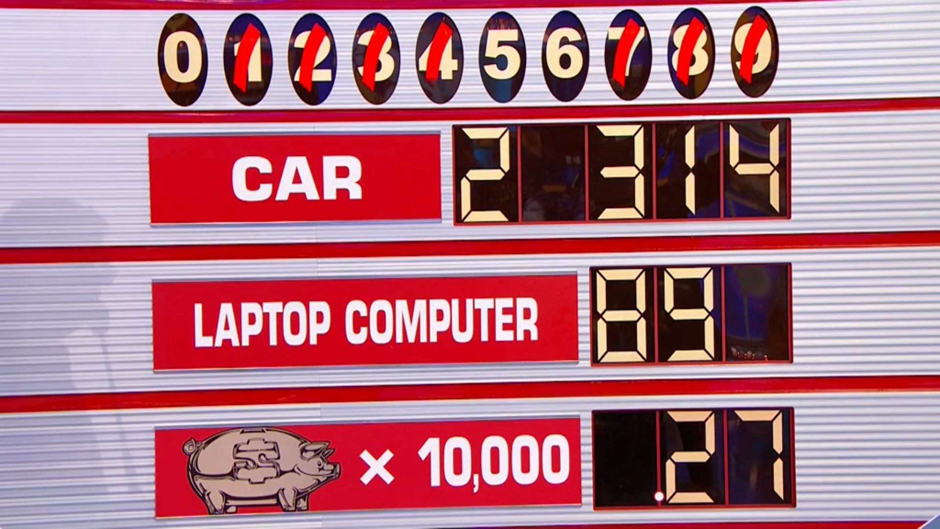 A game board from 'Any Number' featuring a car price of 2314, a laptop computer price of 89, and a piggy bank prize worth up to 10,000, with digits 0-7 displayed above.