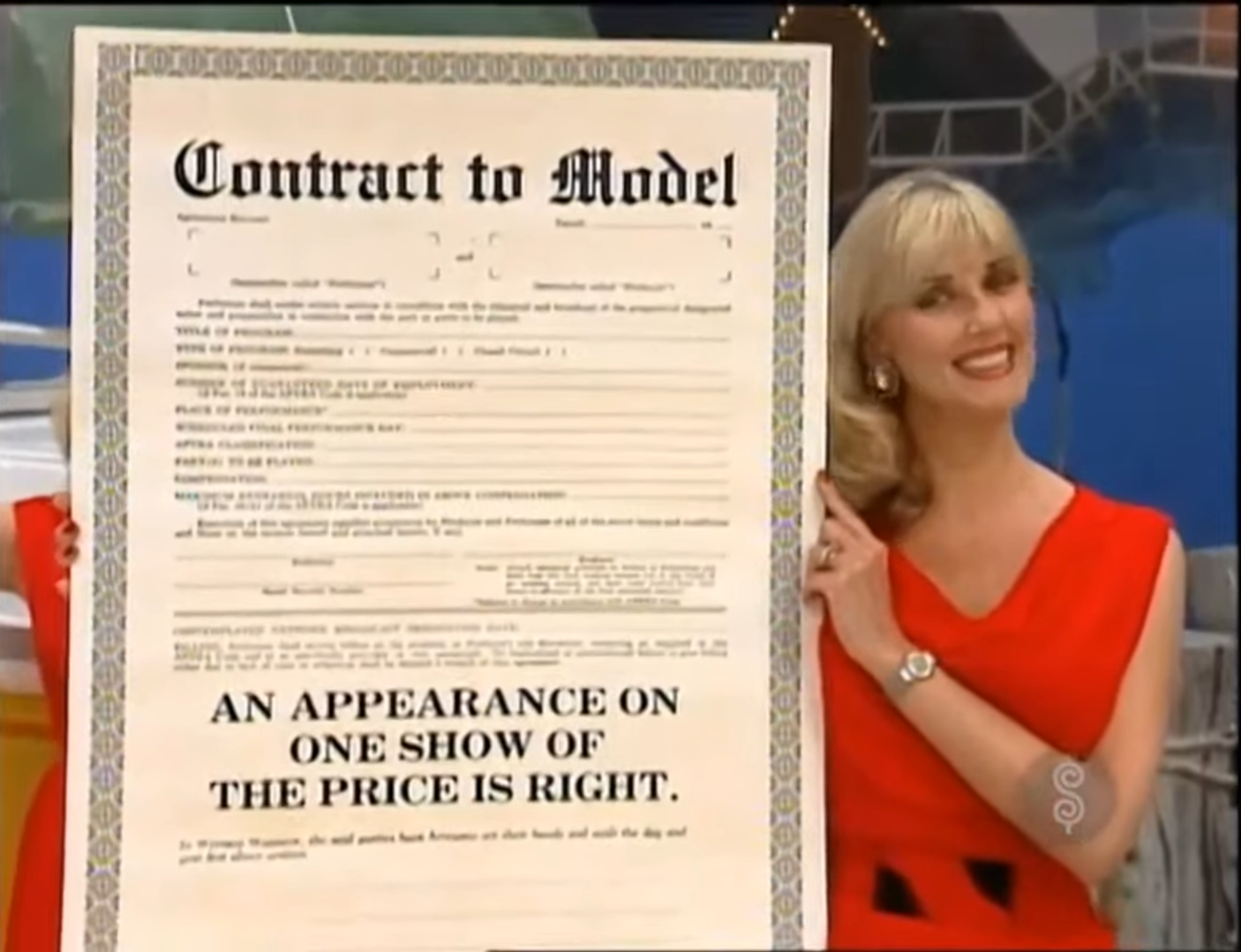 A model in a red dress holds a large 'Contract to Model' document, smiling at the camera.