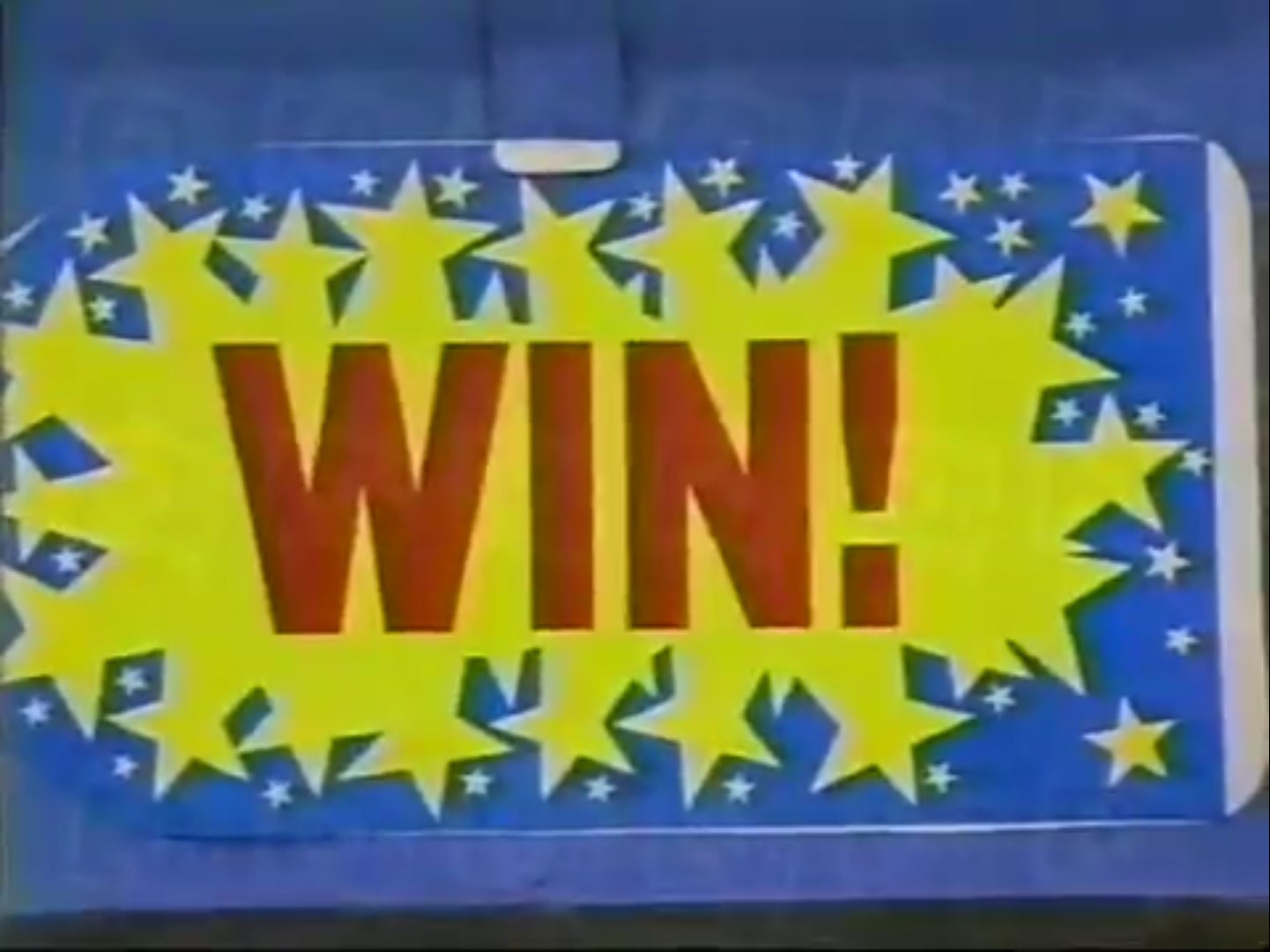 A colorful game sign featuring the word 'WIN!' in bold red letters surrounded by yellow explosion graphics and blue star accents.