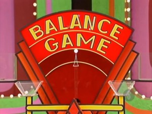 The Balance Game display from The Price is Right in 1984, featuring a colorful background with the words 'BALANCE GAME' prominently displayed.