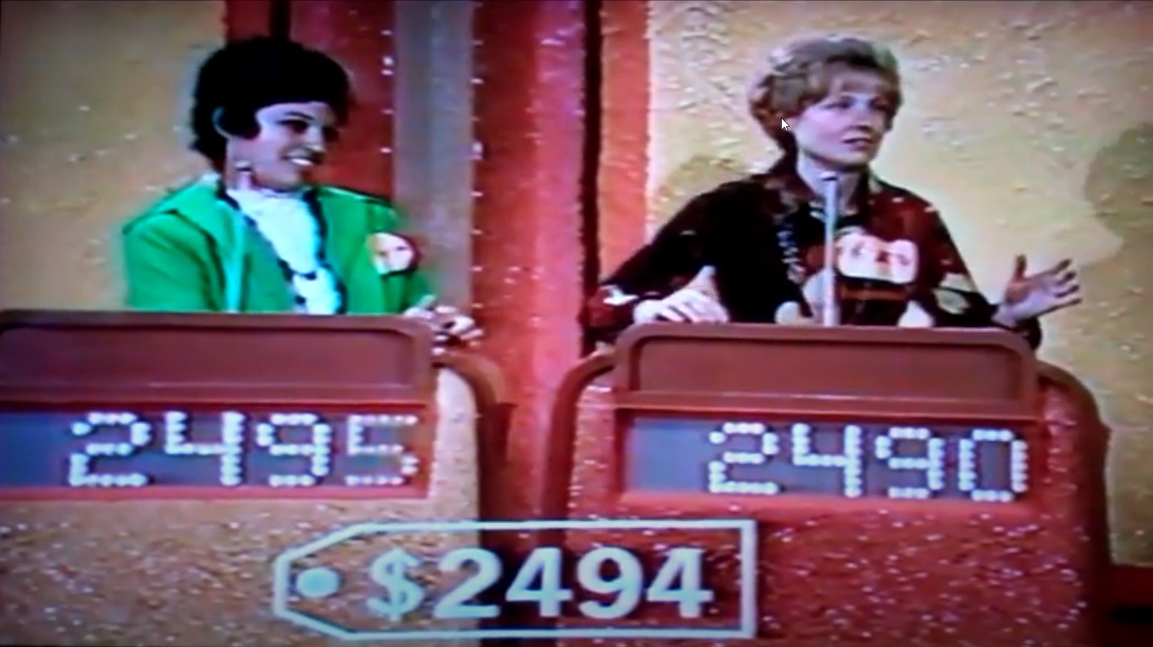 Two contestants participating in the Double Bullseye game, with current bids displayed: 95 and 90.