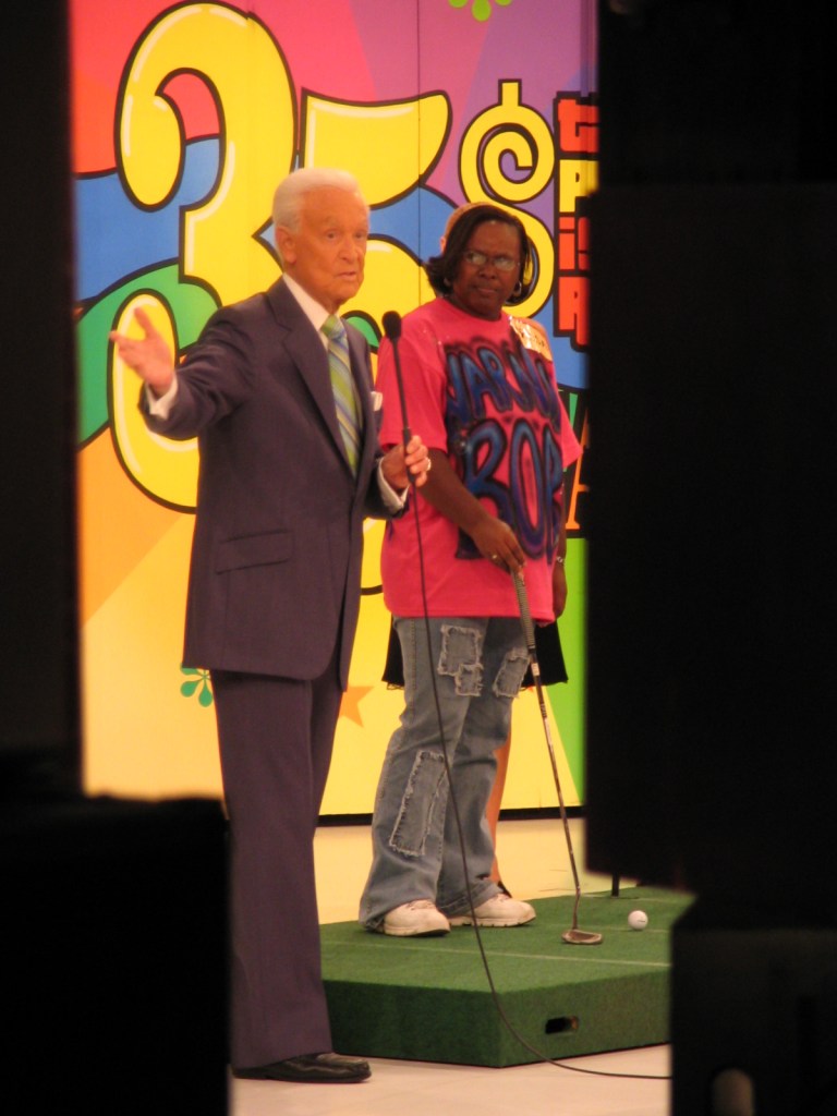 Bob Barker hosting the 35th season of The Price Is Right, with a contestant on stage, colorful background.