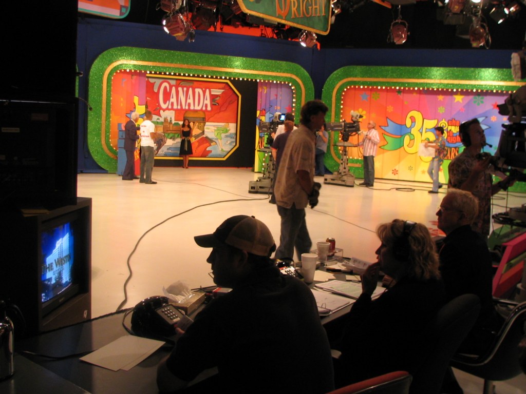 Behind-the-scenes view of the set during the 35th season premiere taping of The Price Is Right, featuring crew members, cameras, and host interactions.