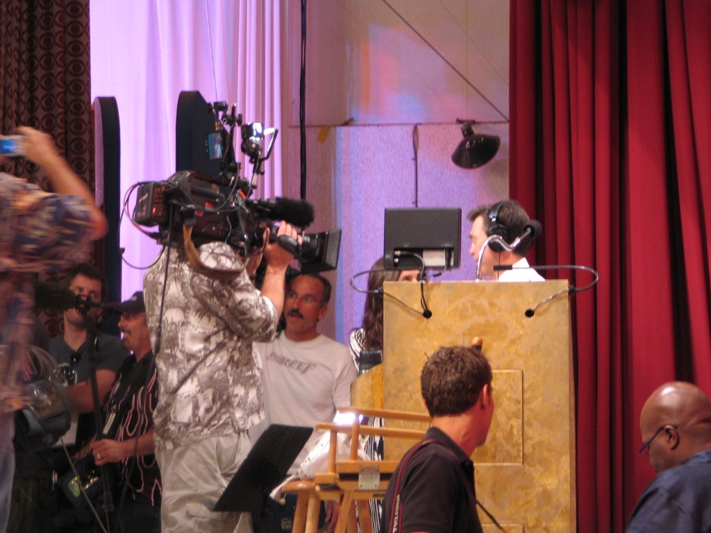 A backstage view during the S35 Premiere week of TPiR, showcasing camera operators and crew members preparing for the broadcast.