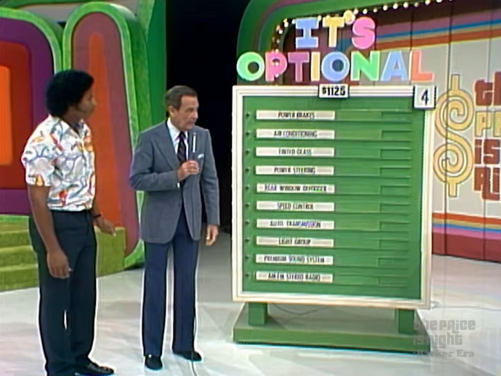 A scene from 'The Price is Right' showcasing a colorfully designed game board reading 'It's Optional' with various optional car features listed.