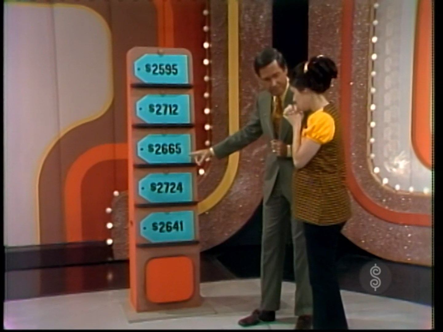 A contestant and Bob Barker are discussing five price tags on The Price is Right, highlighting the possible prices for a car.