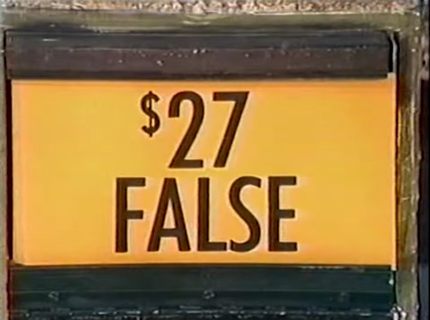price tag marked as FALSE in a game show setting.