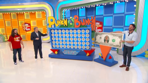 Contestants participating in the game 'Punch-a-Bunch' on The Price is Right, standing in front of a large game board with a colorful display.