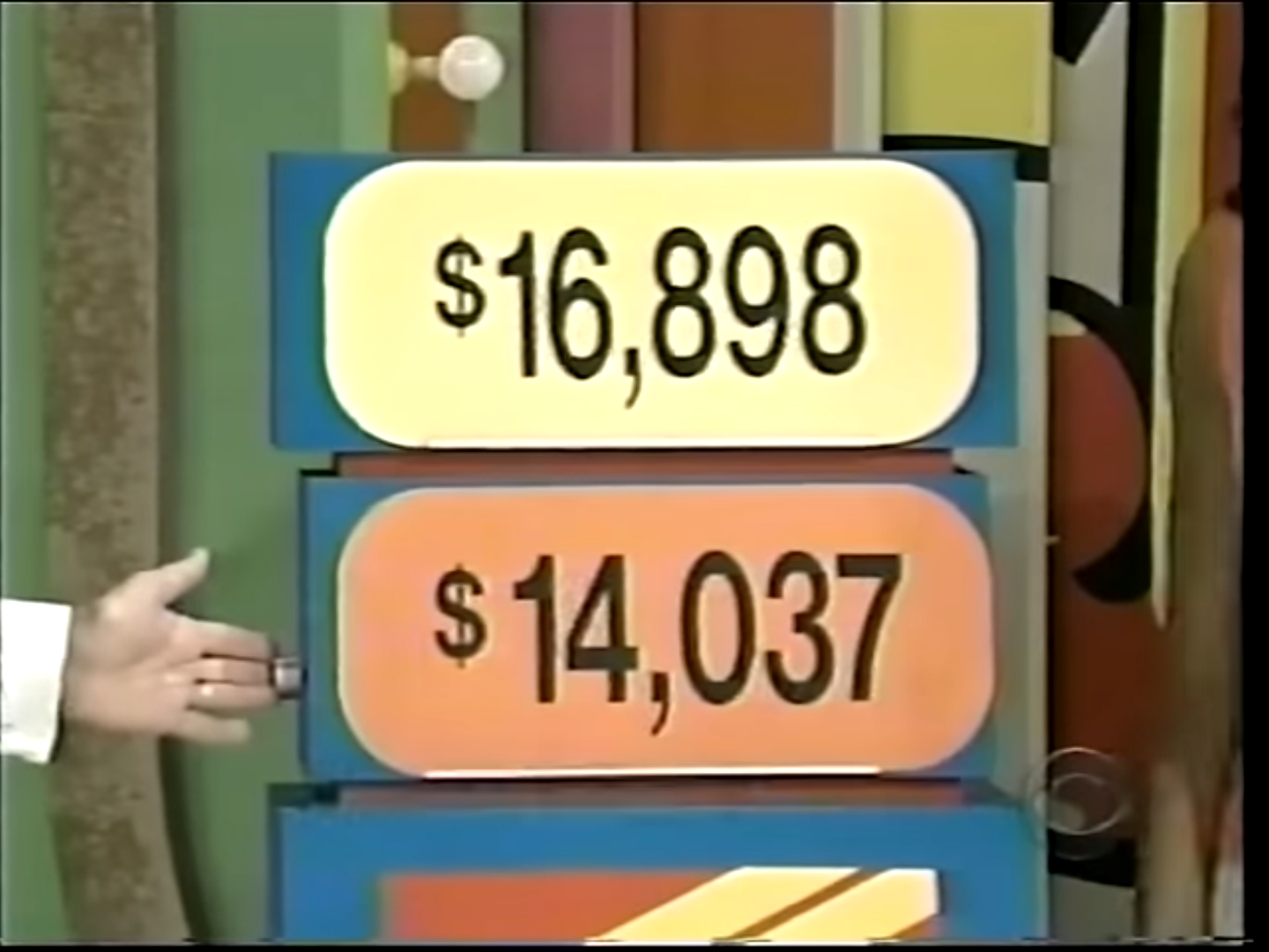 Two price tags displayed for a prize on a game show, with the amounts ,898 and ,037.