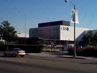 Exterior view of the CBS Television City, showcasing the building's architecture and surrounding landscape.