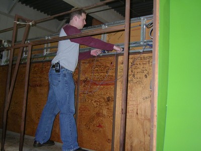 A person adjusting equipment in the pricing game storage area at CBS Television City.