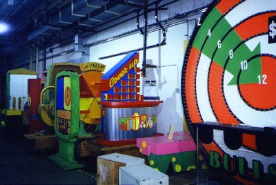 Colorful game set pieces from pricing games at CBS Television City, including a target game and a gameboard storage area.