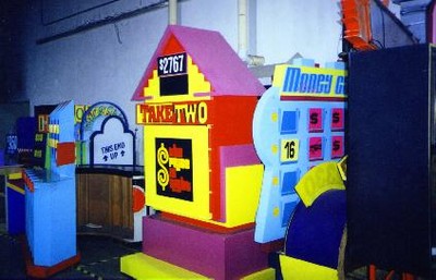 Colorful game show set pieces from a The Price is Right, featuring a large display labeled 'TAKE TWO' and a prize amount of '$2767'.