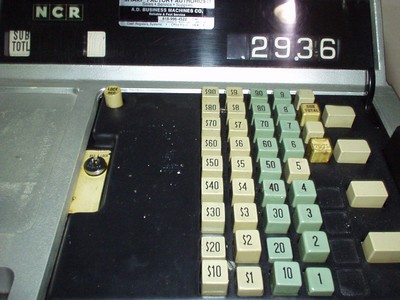 Close-up of a vintage NCR cash register with various keys and a display showing a total of 29.36