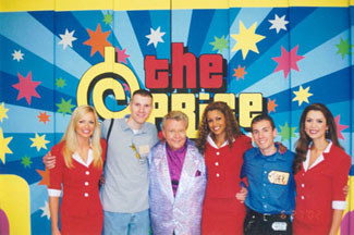 Group photo on the set of The Price is Right, featuring Nikki Ziering, Doug Bradshaw, Rod Roddy, Claudia Jordan, Jake Mangin, and Brandi Sherwood in front of a colorful backdrop with the show's logo.