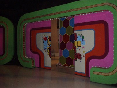 The colorful entrance of a game show stage featuring geometric patterns and decorations.