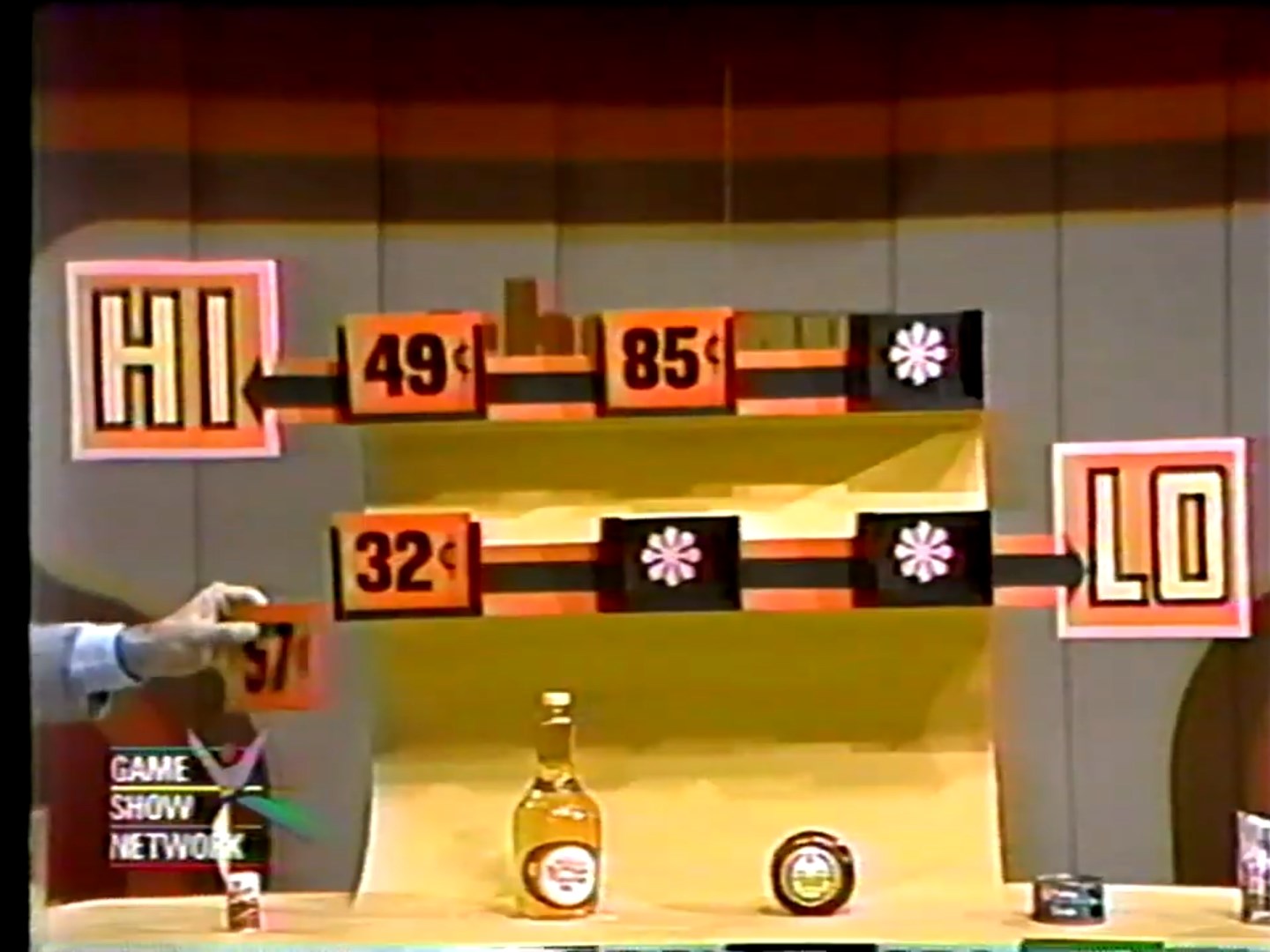 Game show setup for Hi Lo, featuring price slots for 'Hi' and 'Lo' with prices displayed: 49¢, 85¢, and 32¢.