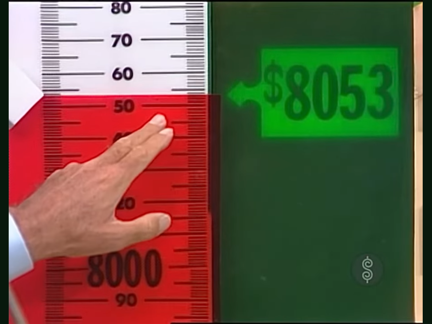 A hand is positioned on a red range finder, showing the scale from <img data-attachment-id=