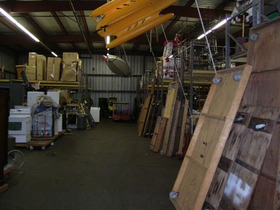 Interior view of the Bob Barker Studio showing various storage items and equipment arranged along the warehouse space.