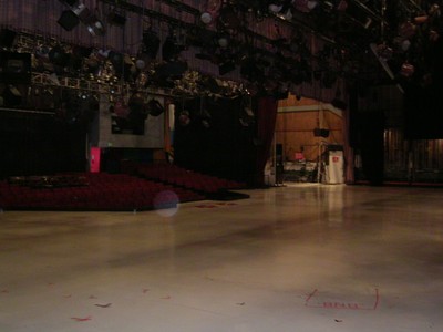 Wide view of the Bob Barker Studio showing empty stage, lights hanging, and audience seating in the background.