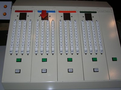 Control panel with multiple switches and indicators used for television game shows.