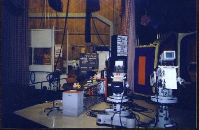 Interior of the Bob Barker Studio featuring camera equipment, a small table, and various props.