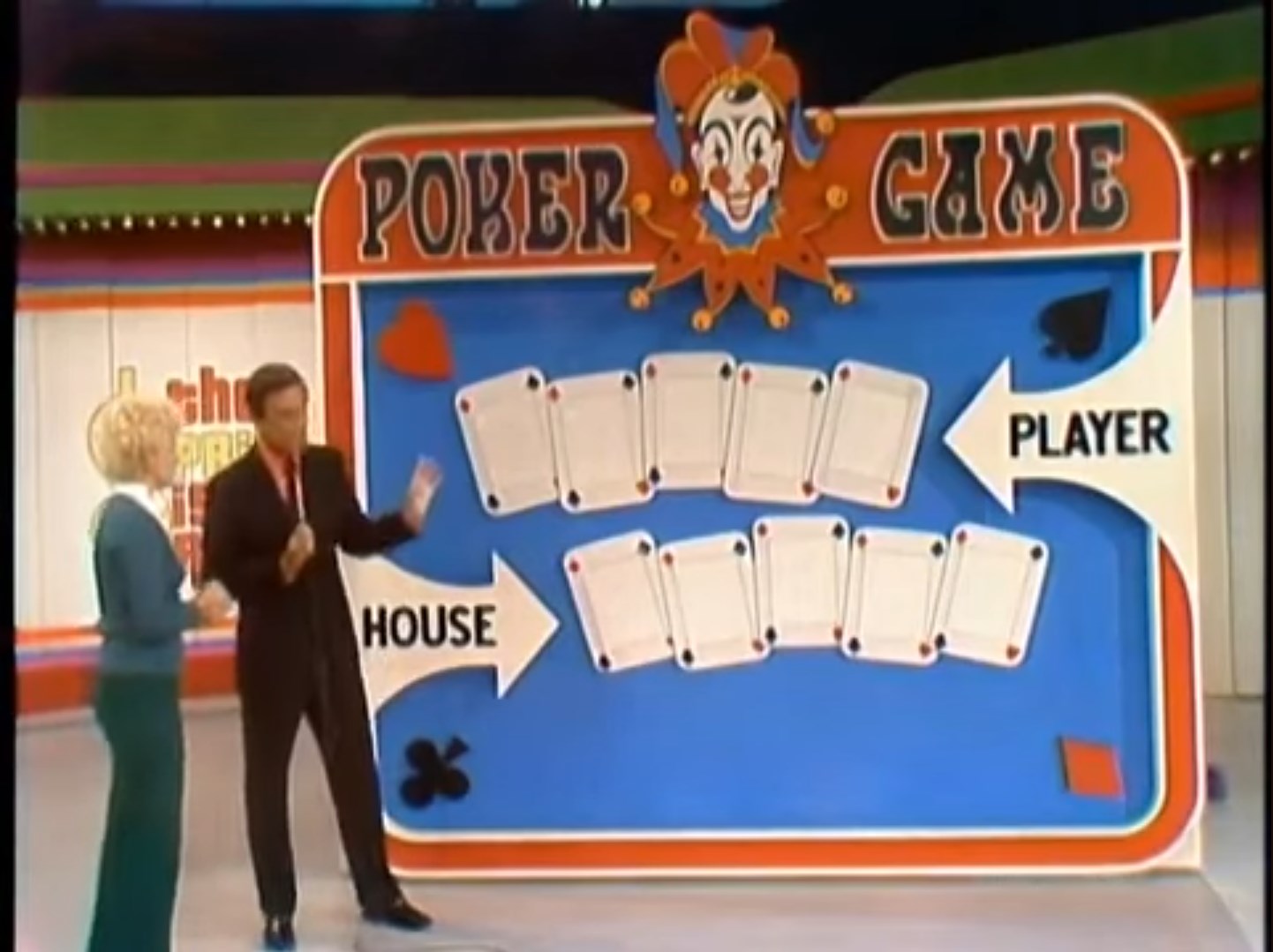 A colorful set design for the Poker Game, featuring a clown graphic, with sections labeled 'PLAYER' and 'HOUSE,' and empty slots for card reveals.