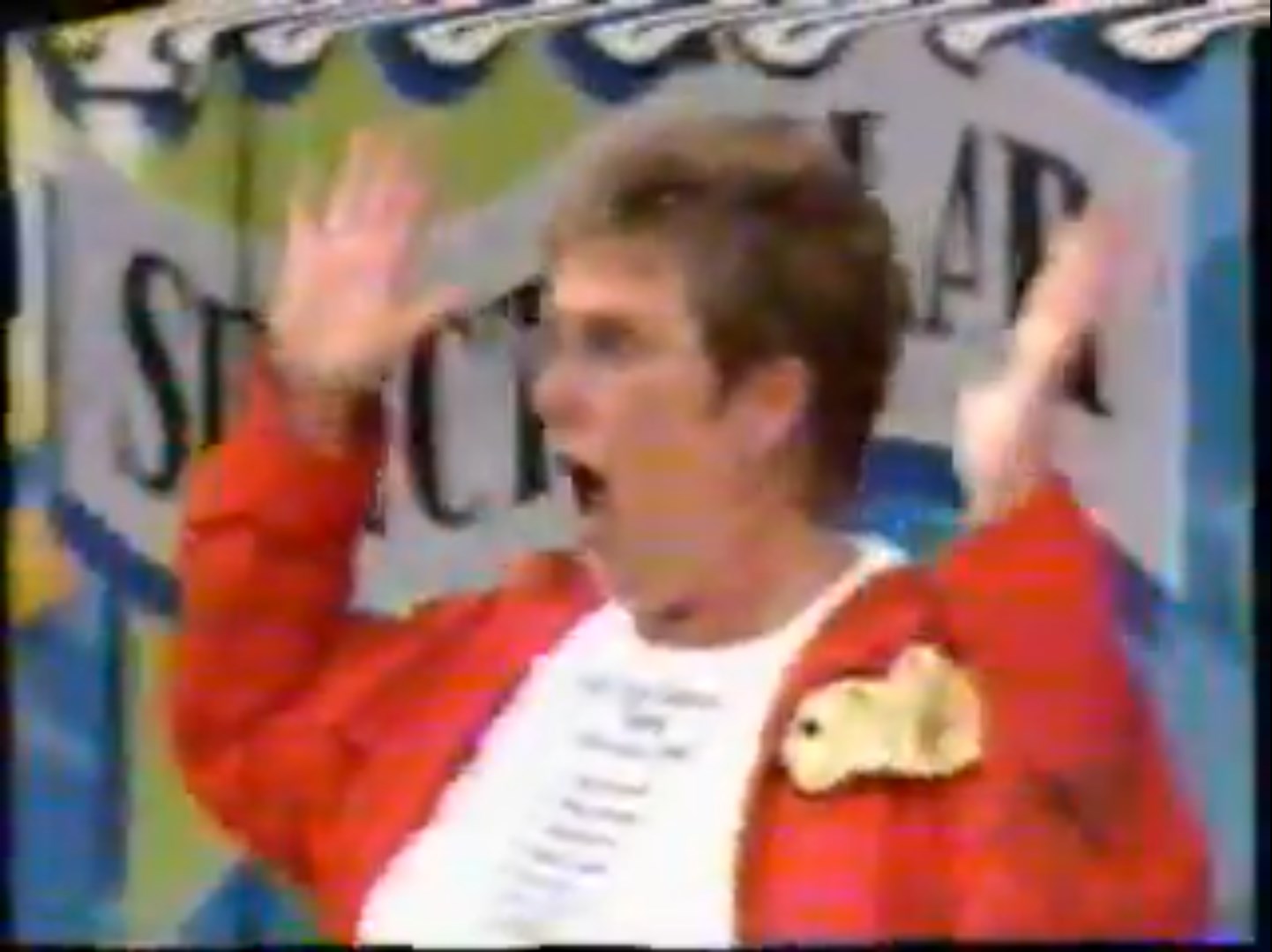 A contestant expresses excitement while playing the game 'One Right Price' on a game show, wearing a red jacket and raising her hands in joy.