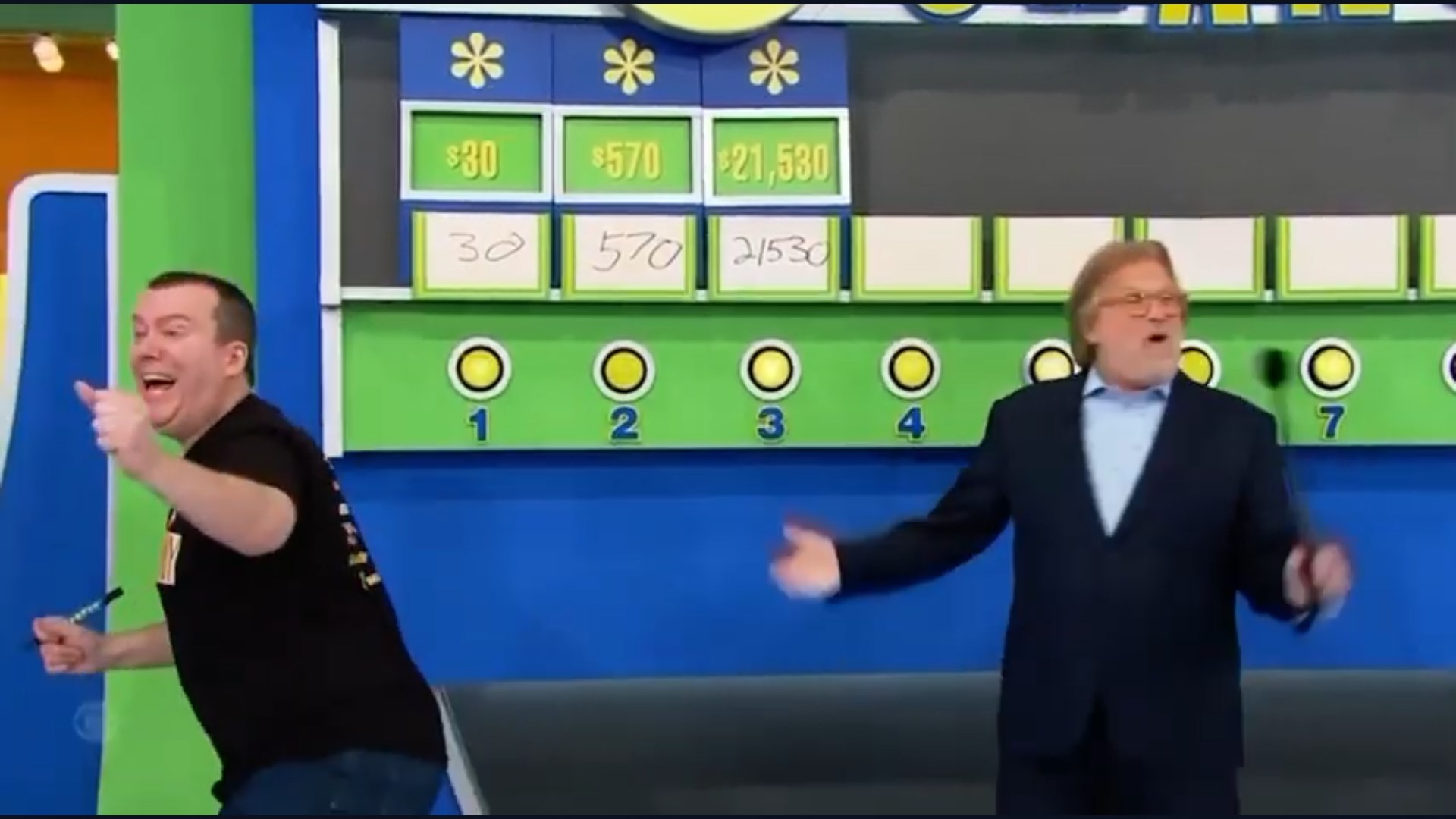Tony Harrison excitedly celebrates while pointing thumbs up after playing Ten Chances perfectly on The Price is Right.