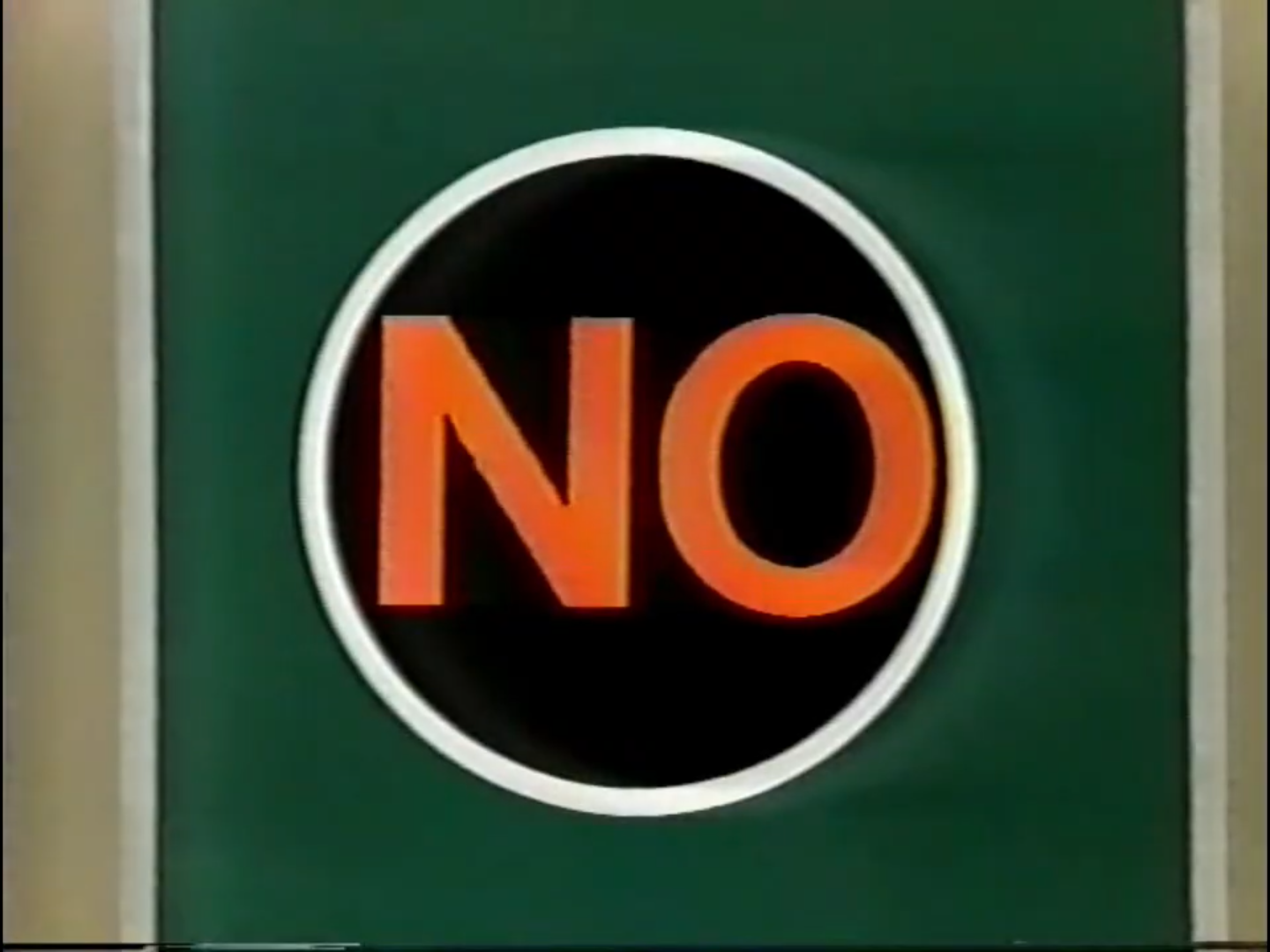 A sign displaying the word 'NO' in bold orange letters against a green background.