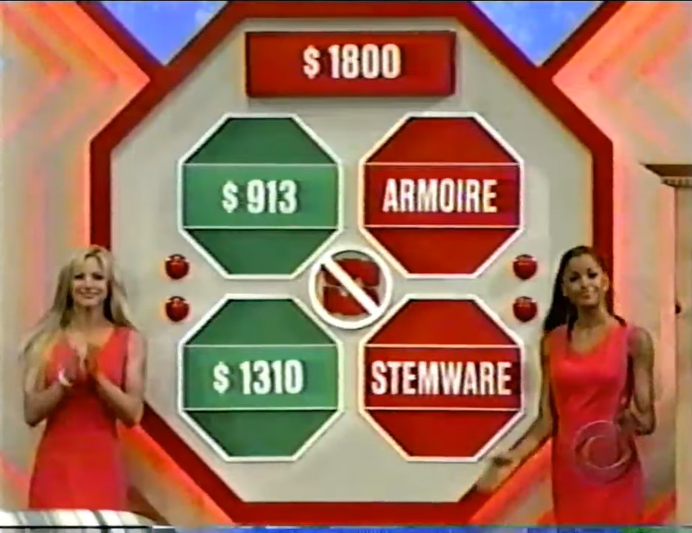 Gameboard for Danger Price with prizes displayed and two female hosts, featuring prices of 3, 10, and 00, alongside the items 'Armoire' and 'Stemware'.