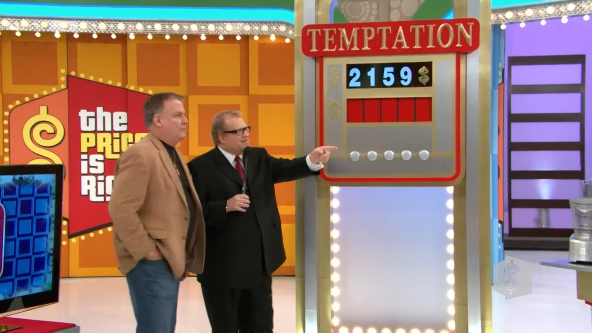 Contestants discussing their strategy in the game 'Temptation' on stage, with the game board displaying the current digits for the car's price.