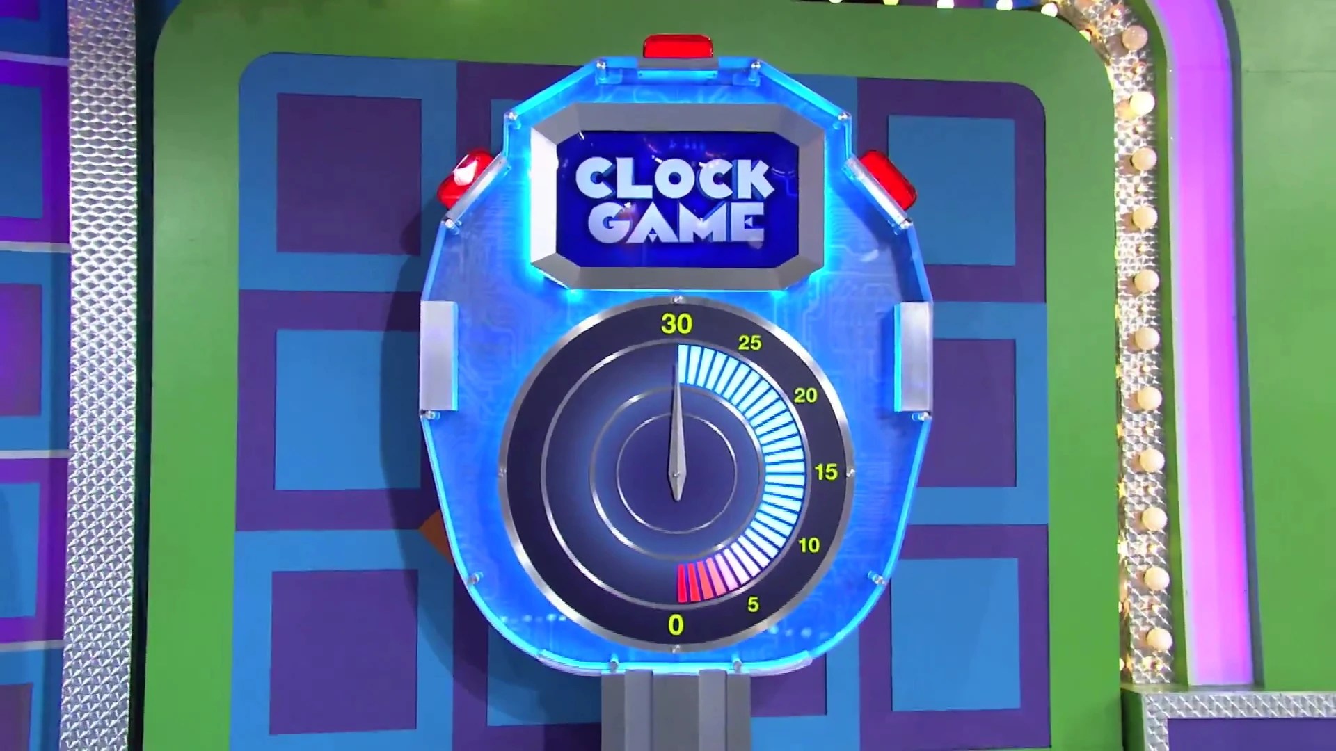 A close-up of the Clock Game display featuring a large circular timer showing 30 seconds, set against a colorful background.