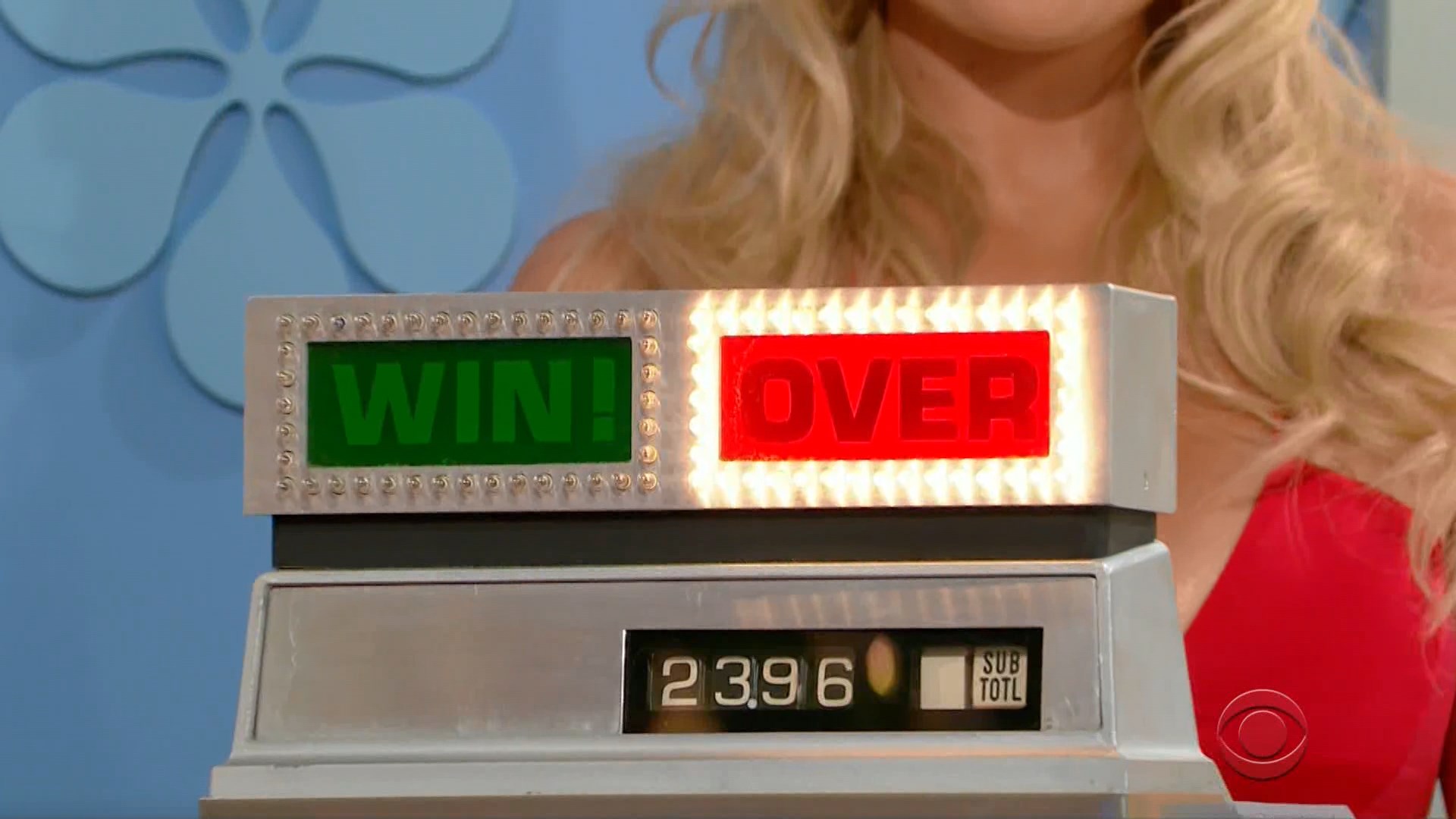 Cash register displaying 'WIN!' in green and 'OVER' in red, showing a subtotal of 23.96.