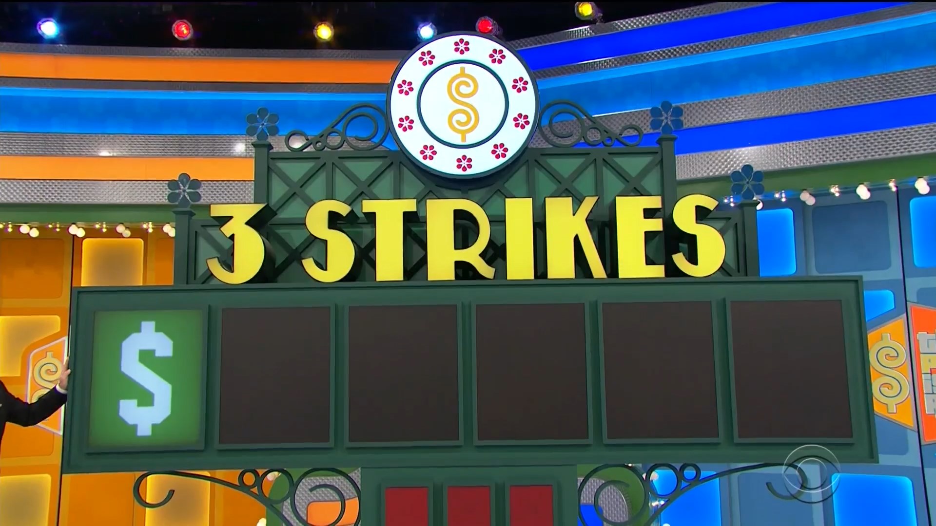 Game display board for 'Three Strikes' featuring the game title in bold yellow letters and empty slots for displaying numbers.