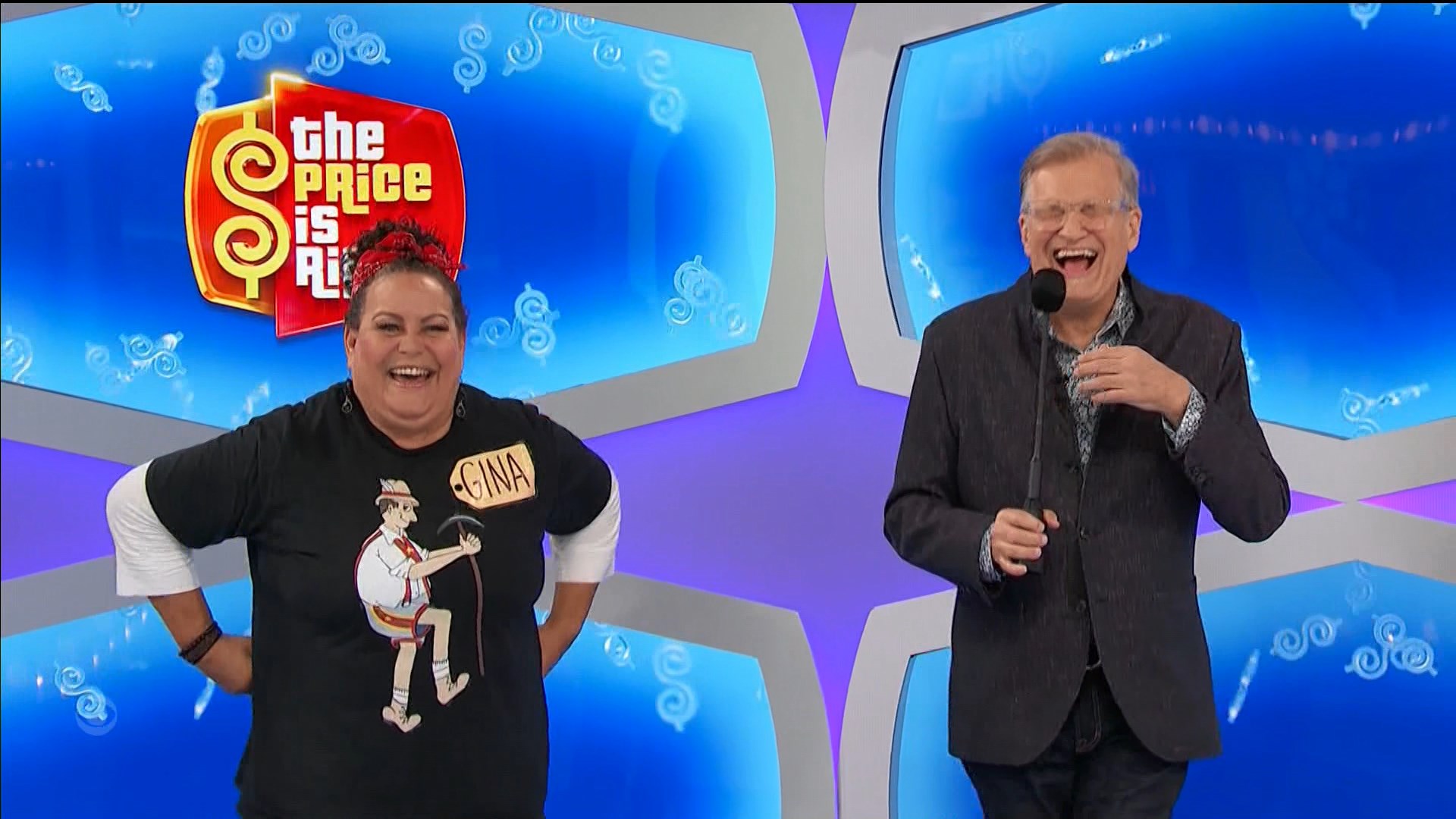 Contestant Gina smiling and laughing with host Drew during The Price is Right, with a colorful game backdrop.