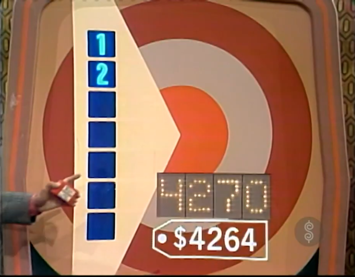 Game board for Bullseye featuring numbered markers and a target circle with price display.