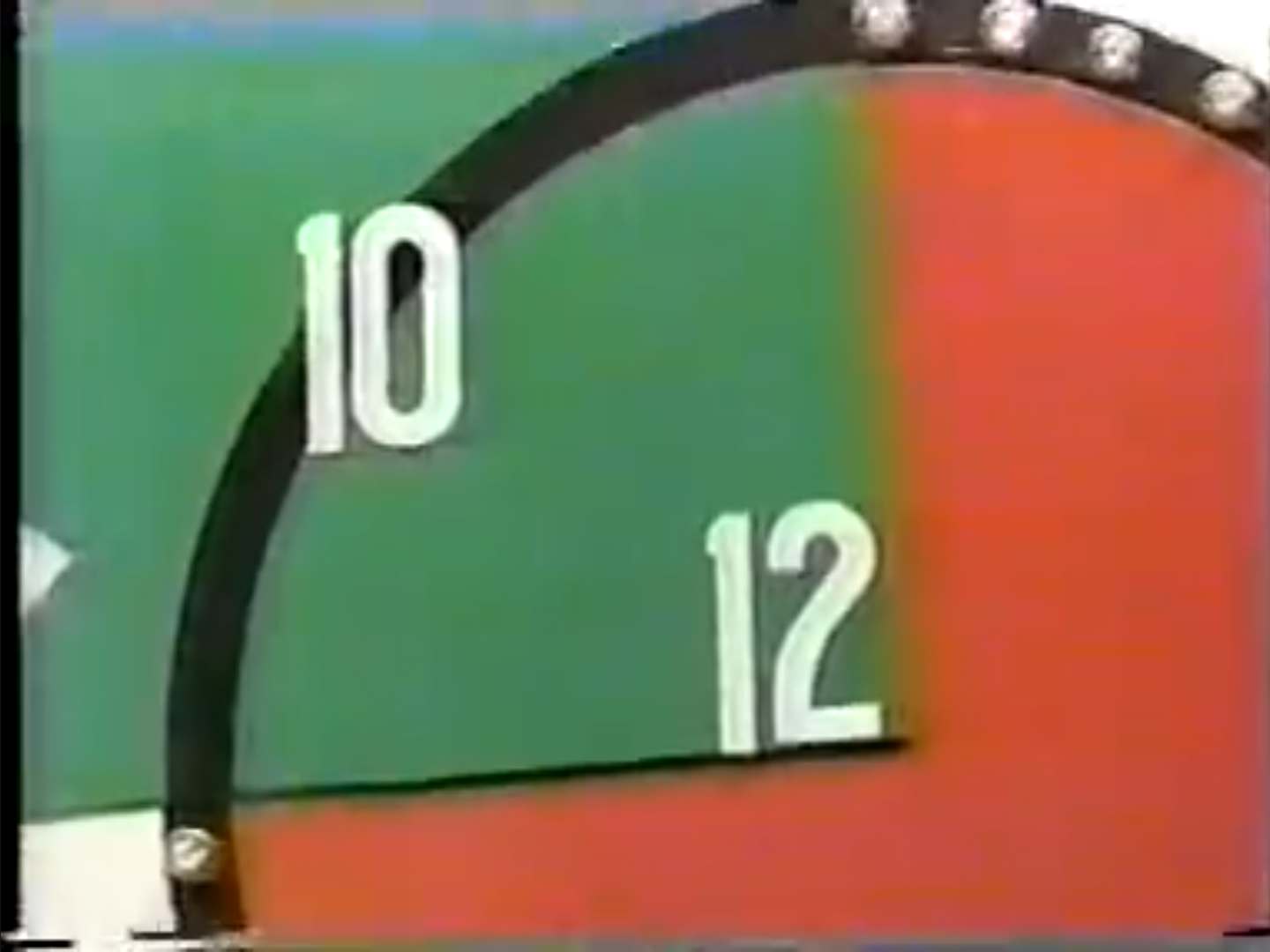 A scoreboard showing the numbers 10 and 12, indicating the target range for the Bullseye game.