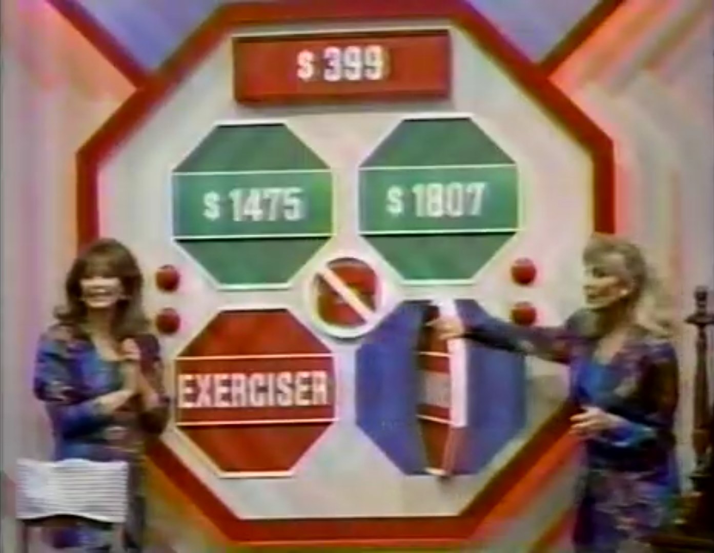 Game show host and contestant near the Danger Price board with four prize amounts, including a highlighted Danger Price of 9.