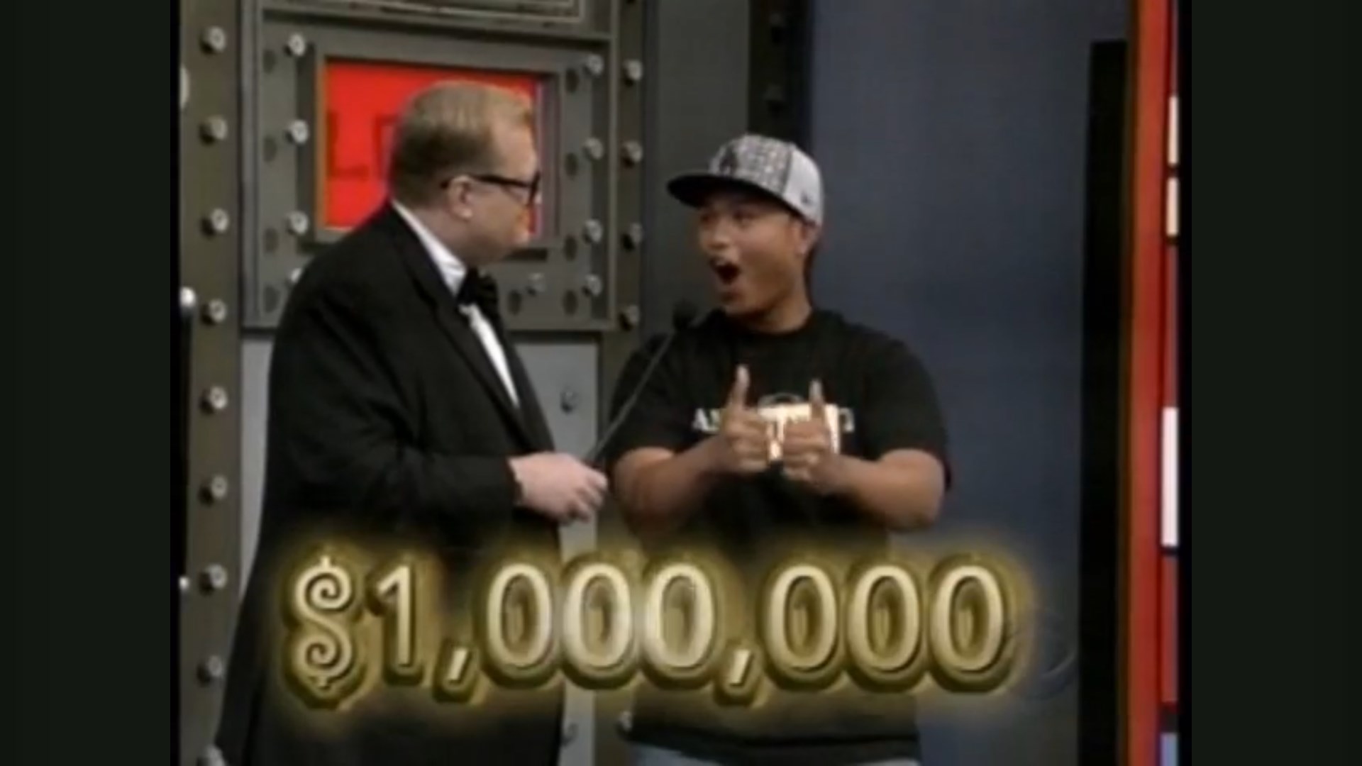 A contestant celebrates with thumbs up next to Drew Carey, showcasing the prize amount of ,000,000 available.