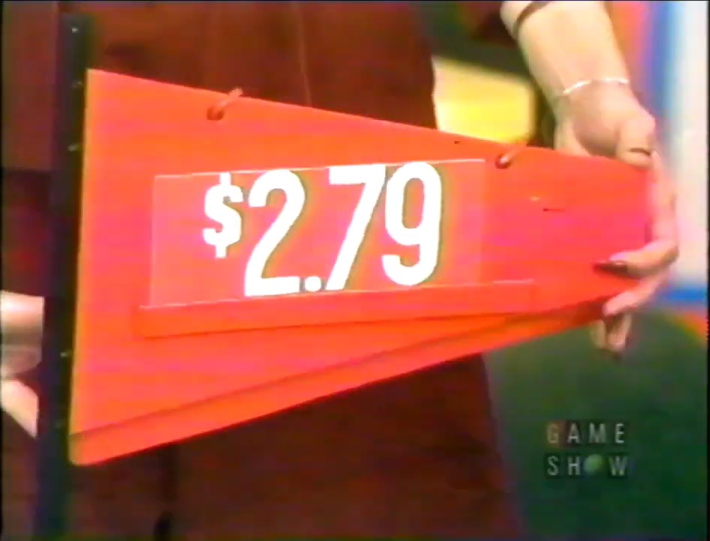 .79 price tag displayed on a red sign held by a model on The Price is Right.