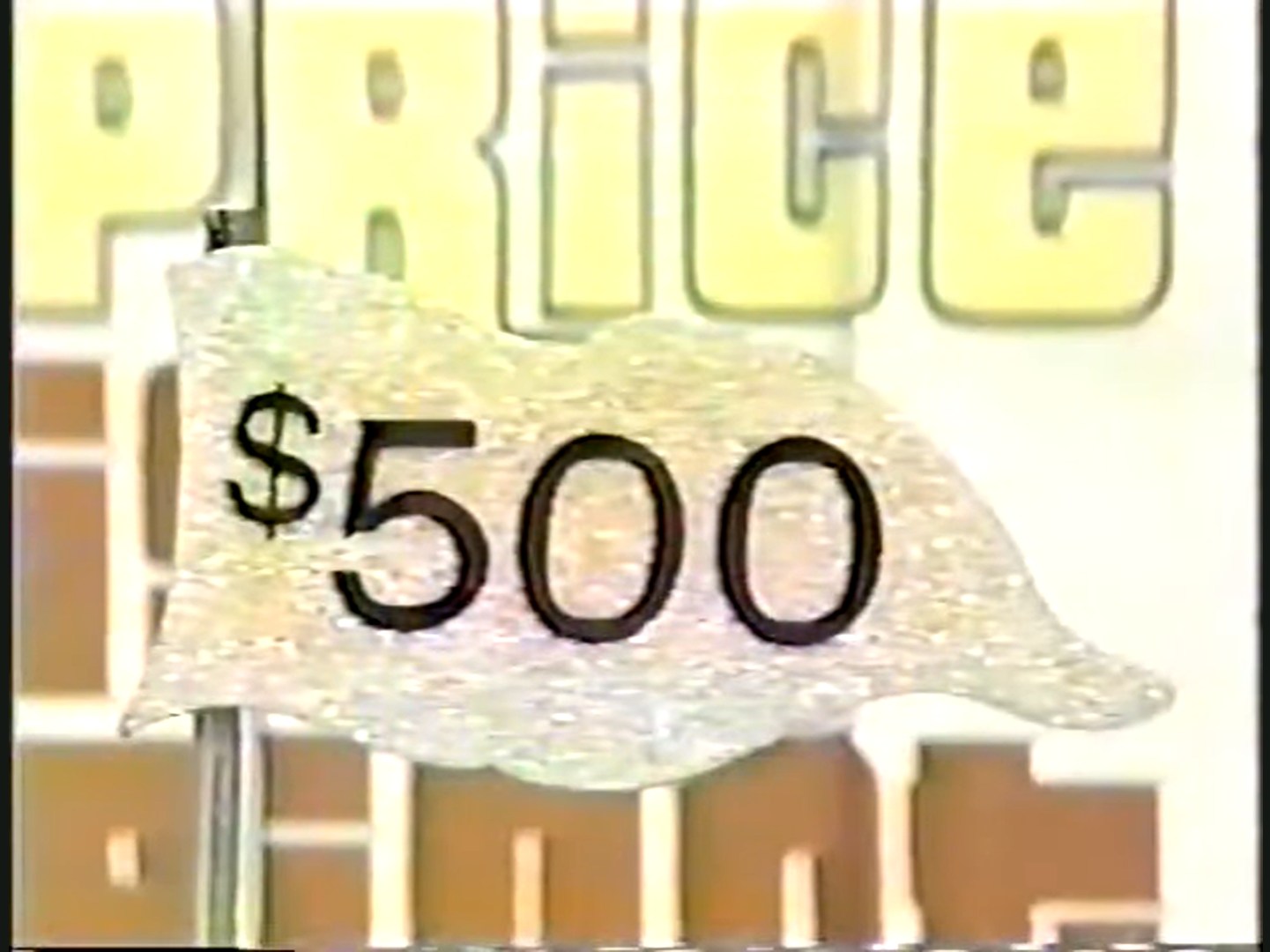 A gold $500 flag from $1983 without a ball at the top.