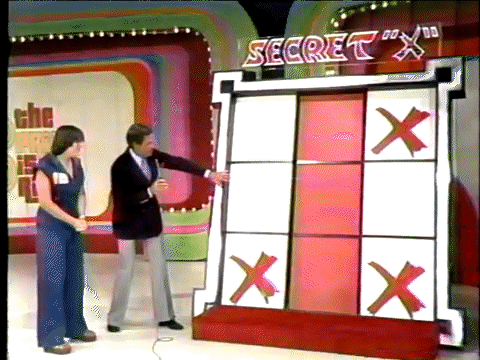 The crowd and contestant celebrate as the Secret X is revealed.