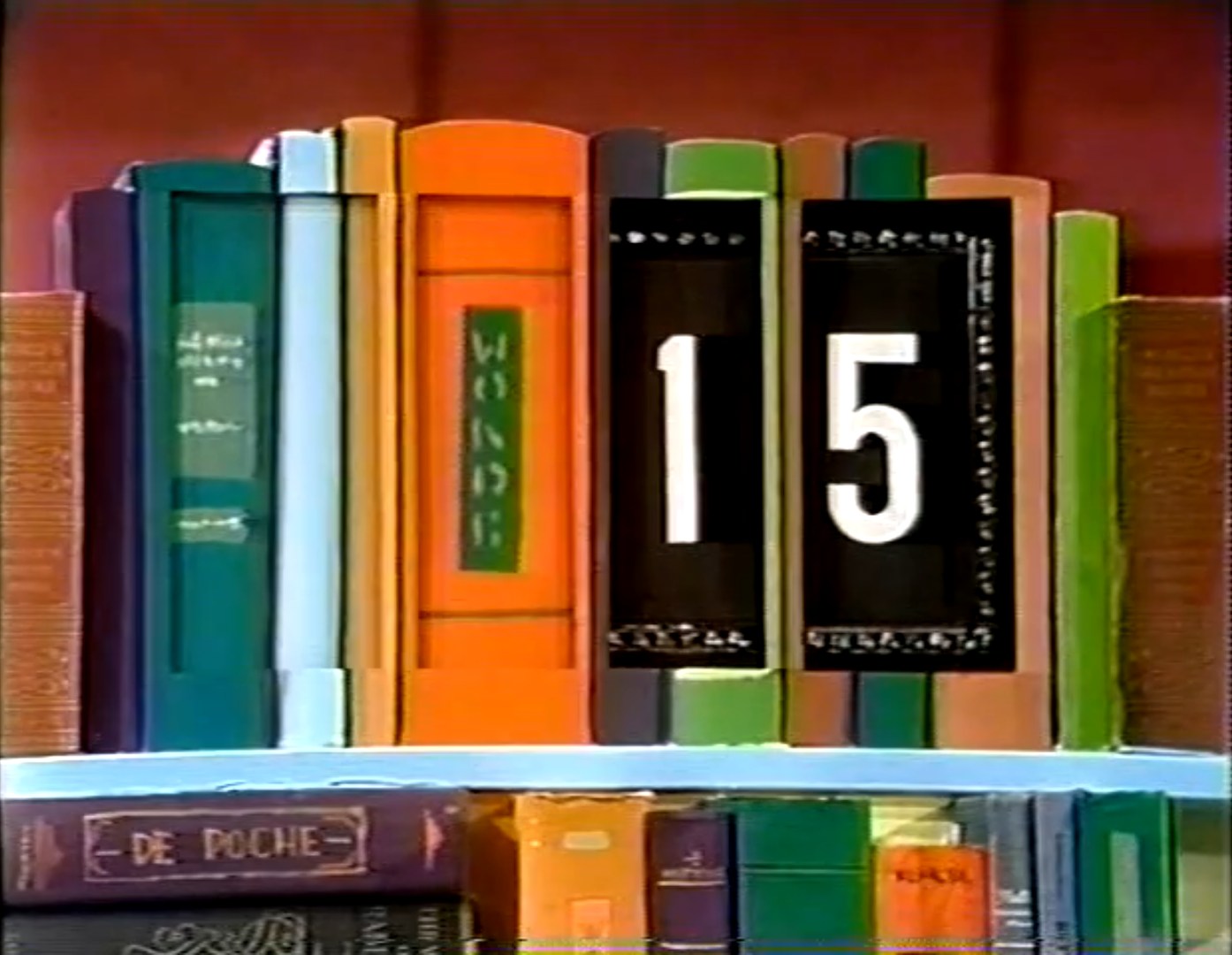 Colorful books arranged on a shelf, with a '15' prominently displayed in the center.