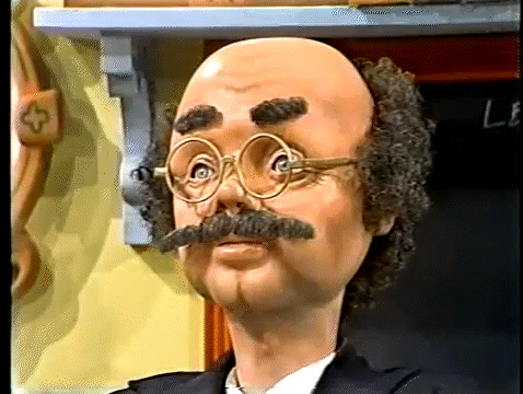 The Professor Price puppet nods in response to a question posed by Bob Barker.