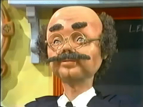 The Professor Price puppet begins by angrily shaking his head, before changing to a nod.