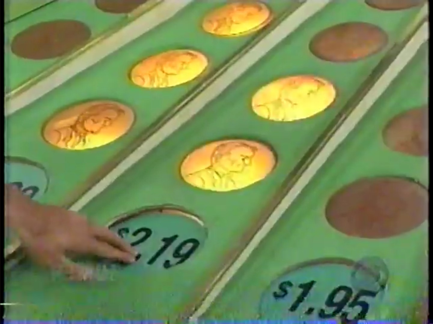 Bob Barker pressing down $2.19 on the Penny Ante game on The Price is Right.