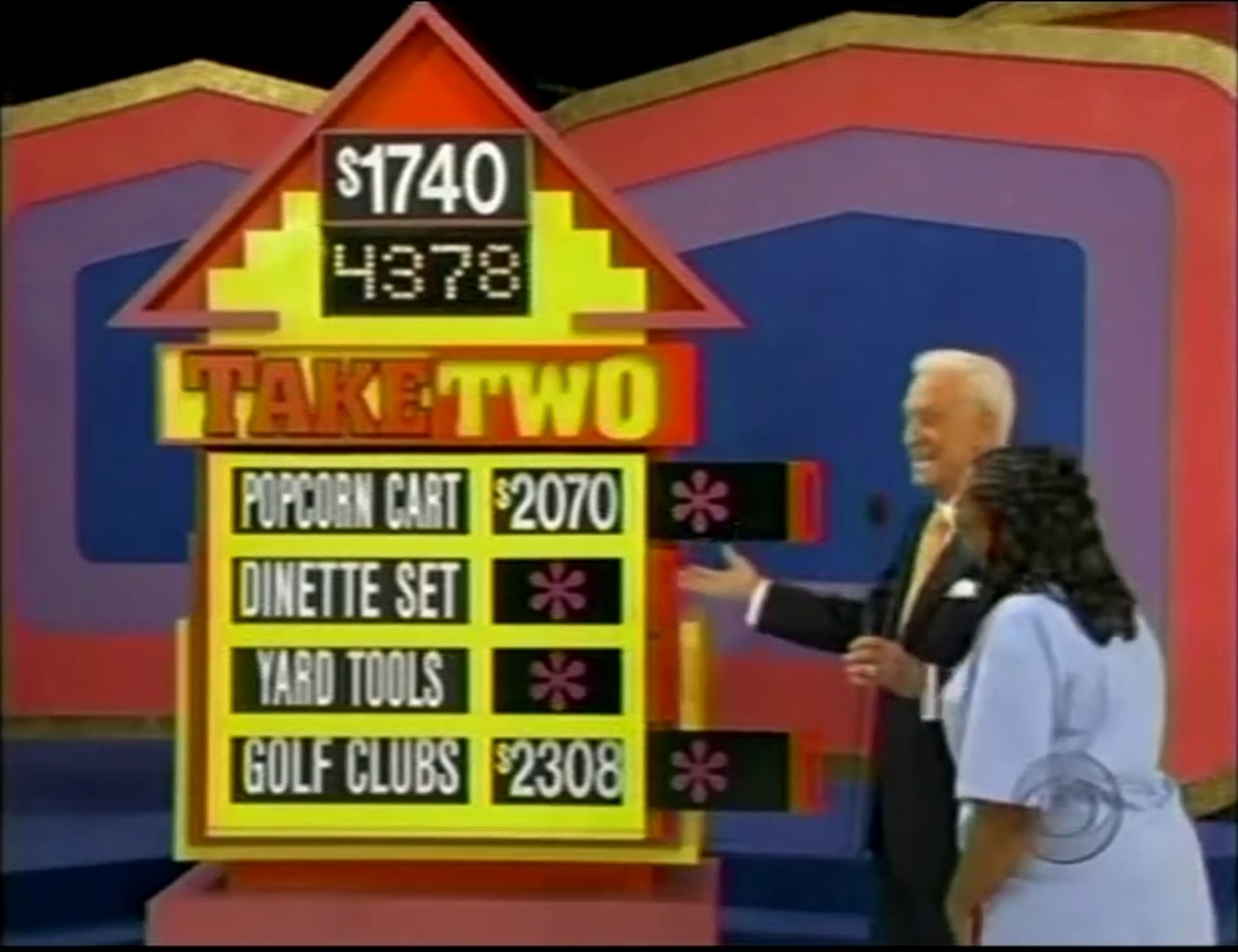 A contestant and host interact during the Take Two game on The Price is Right, displaying a target price of 40 and four prizes: Popcorn Cart, Dinette Set, Yard Tools, and Golf Clubs.