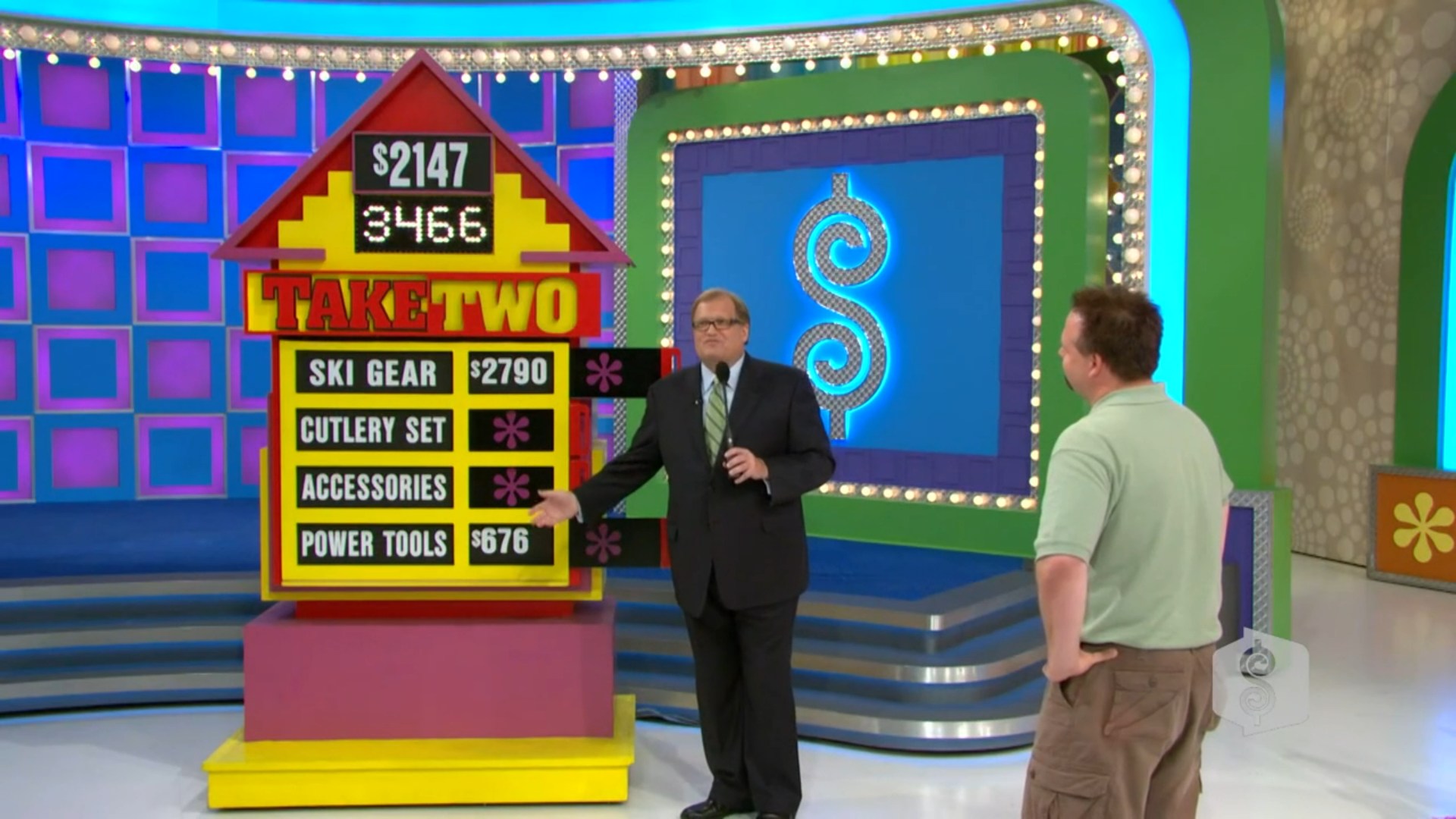 A game show scene featuring a 'Take Two' board displaying different prize values, with the host explaining the game to a contestant.