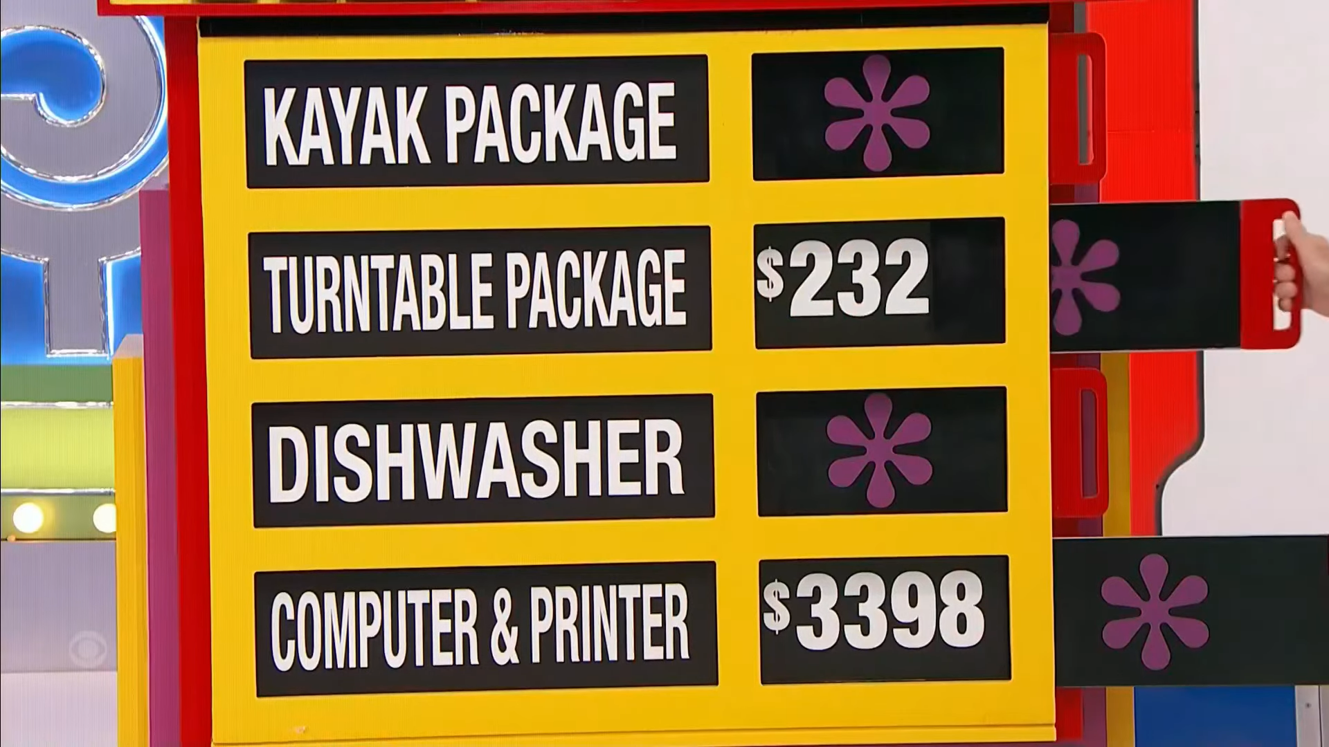 A game board displaying four prizes: a kayak package, a turntable package priced at 2, a dishwasher, and a computer and printer with a price of 98.
